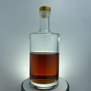 Cylindrical glass spirit bottle