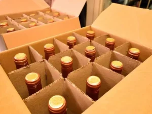 Quantas garrafas há em uma caixa de uísque?
